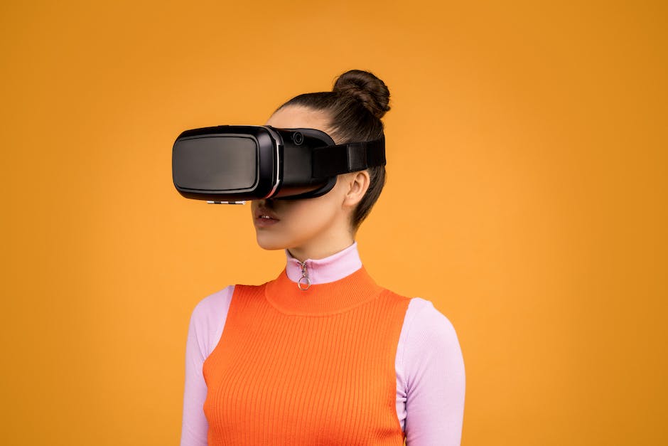 An image depicting a person wearing a VR headset and interacting with virtual objects